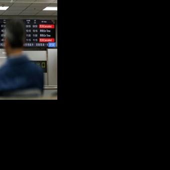 Flight information display boards show cancelled flights at Taipei Songshan Airport