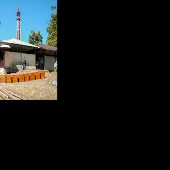 Coffins are prepared at a cemetery for victims of a Myanmar military air strike at a hospital