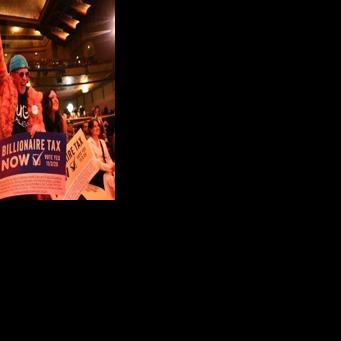 People chant in support of a tax on billionaires during a Bernie Sanders rally in Los Angeles in February