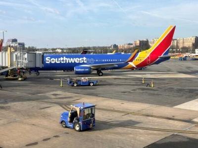 A Southwest Airlines Boeing 737 sits at a gate at Washington's Reagan National Airport (DCA) in Arlington, Virginia, on March 31, 2024