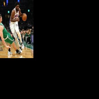 Philadelphia's Joel Embiid collides with Luka Garza of the Boston Celtics in the 76ers' series-clinching victory in the NBA Eastern Conference playoffs