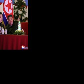 This picture taken on December 31, 2025 and released by North Korea's official Korean Central News Agency (KCNA) via KNS on January 1, 2026 shows North Korean leader Kim Jong Un, his daughter Kim Ju Ae (C) and wife Ri Sol Ju (L) watching a New Year's…