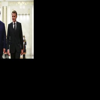 China's President Xi Jinping (L) and France's President Emmanuel Macron attend a welcome ceremony at the Great Hall of the People in Beijing on December 4, 2025