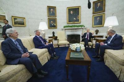 Senate Minority Leader Mitch McConnell of Ky., Speaker of the House Kevin McCarthy of Calif., and Senate Majority Leader Sen. Chuck Schumer of N.Y., listen as President Joe Biden speaks before a meeting to discuss the debt limit in the Oval Office of th...