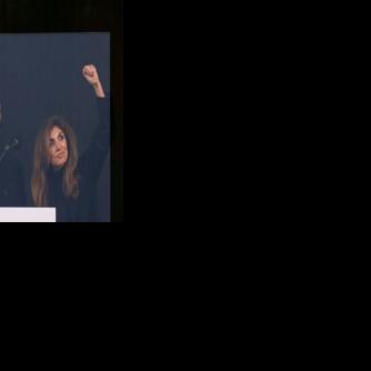 Iran's former crown prince and now key opposition figure Reza Pahlavi flashes the victory sign to a mass protest in Munich