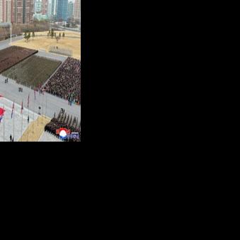 A picture released by North Korea's official Korean Central News Agency (KCNA) on December 13 showing North Korean leader Kim Jong Un (at podium) attending a welcoming ceremony for the Korean People's Army's 528th Regiment of Engineers, which returned…