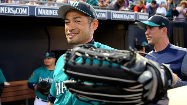 Ichiro Suzuki (R), Major League Baseball team Seattle Mariners new signing  outfielder holds up his jersey with Mariners GM Jerry Dipoto at a press  conference at the team's spring training baseball complex