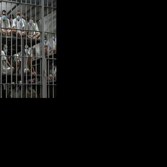 Prisoners are pictured at El Salvador's notorious CECOT prison