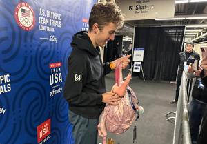 A pink backpack and an odd phone case are US Speedskating's fantasy football punishments
