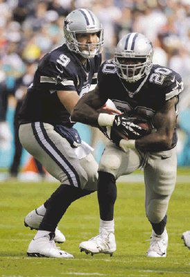 Romo rallies Cowboys past Dolphins