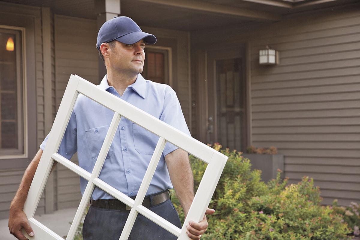 man holding window