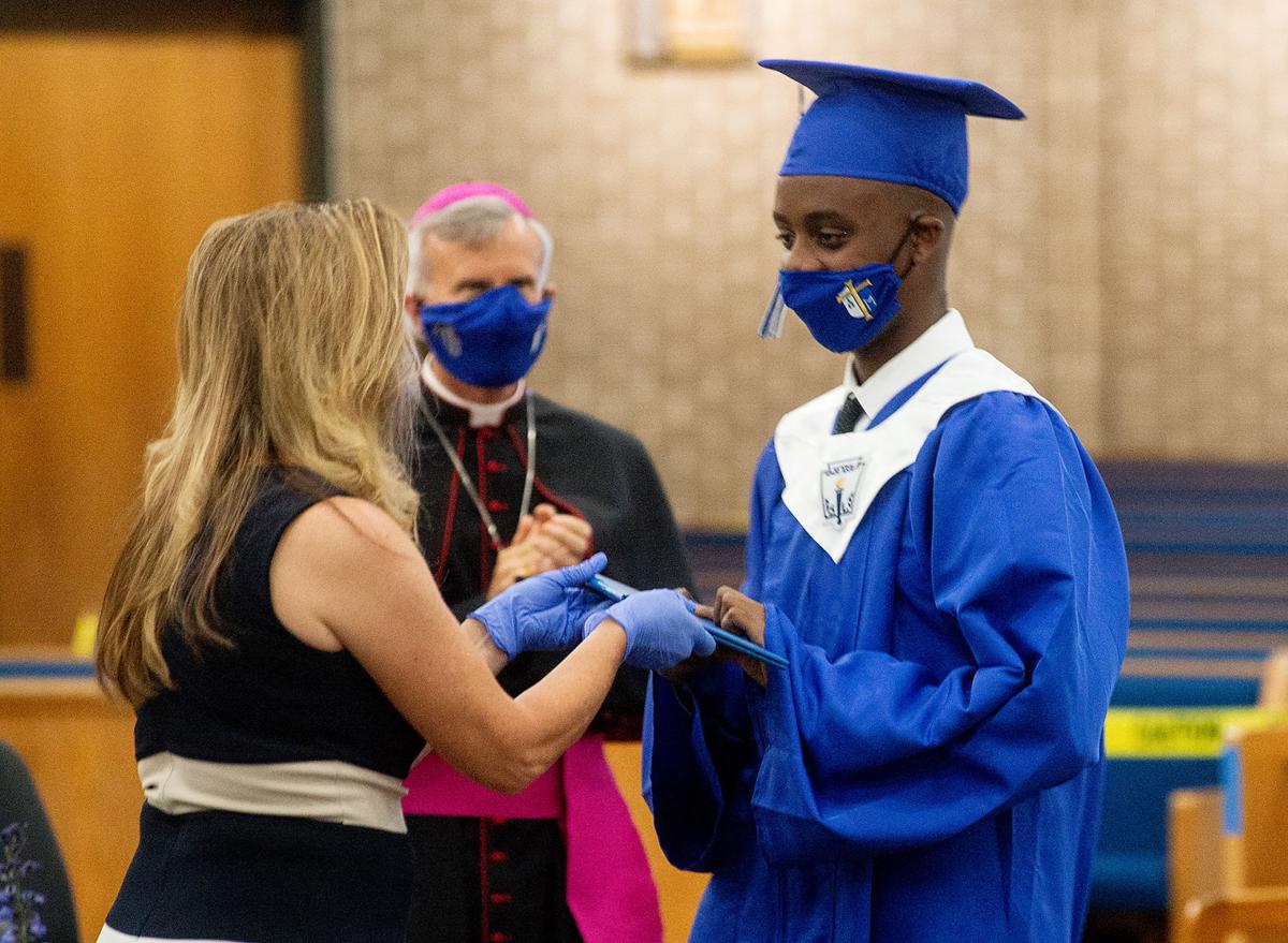 Caps, gowns and masks St. Mary's seniors celebrate graduation despite