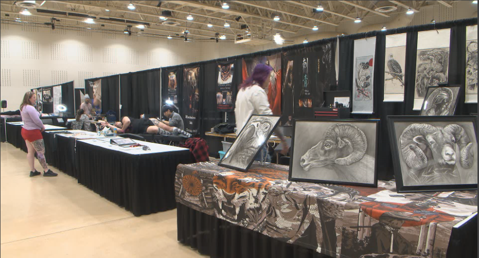 A tattoo artist working on a mans back at a Tattoo Convention at Nassau  Coliseum in Uniondale Long Island New York Stock Photo  Alamy