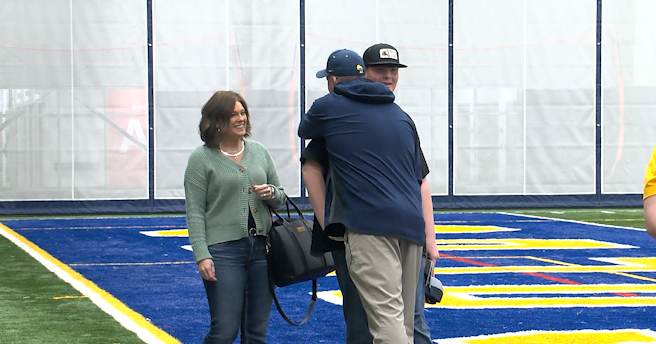 College coach reunites with teen he saved from choking