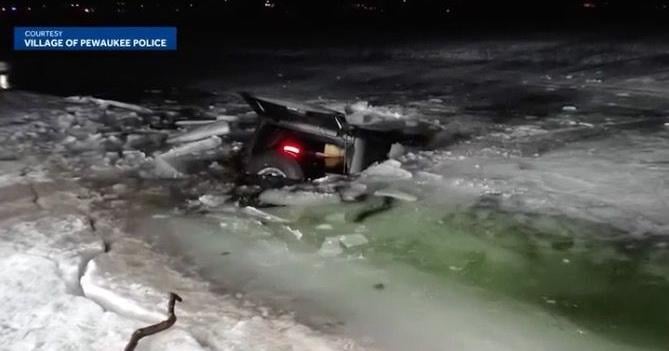 Tow crews recover SUV after it falls through ice on Wisconsin lake