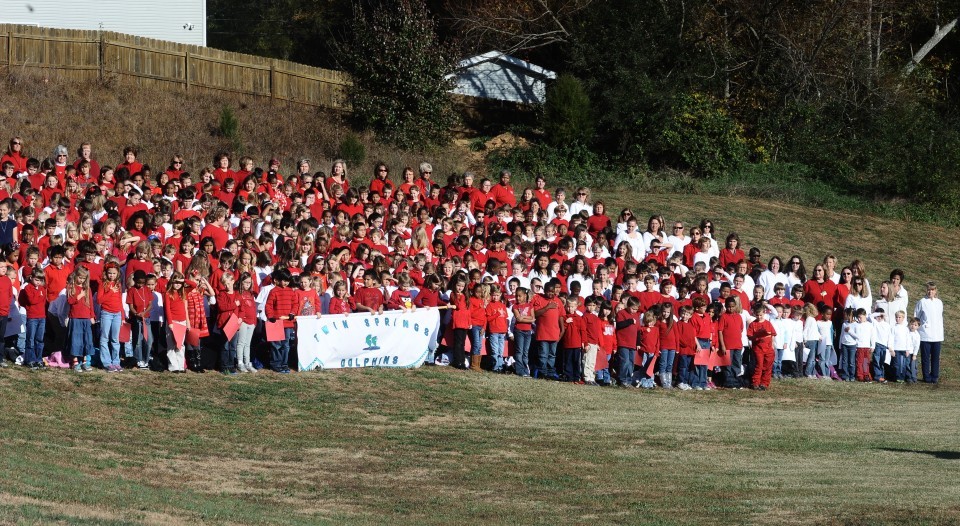 Twin Springs Elementary students form huge American flag in tribute to