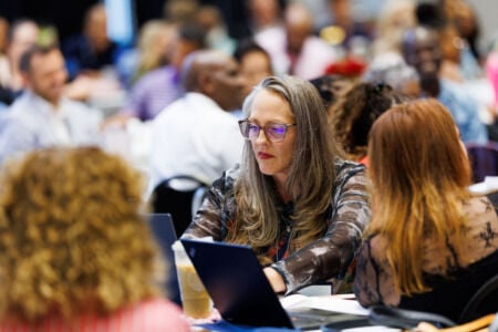 Weeklong event opens door for online doctoral students to explore campus, receive in-person instruction