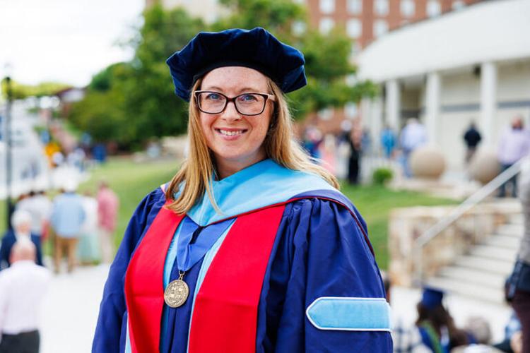 Liberty graduate who spent months on life support with COVID defies odds and lives to complete doctorate
