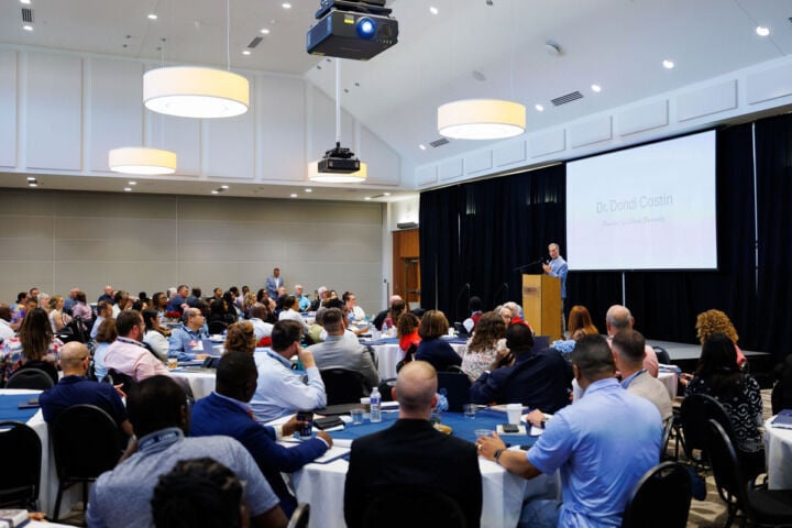 Weeklong event opens door for online doctoral students to explore campus, receive in-person instruction