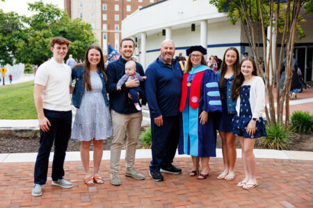Liberty graduate who spent months on life support with COVID defies odds and lives to complete doctorate
