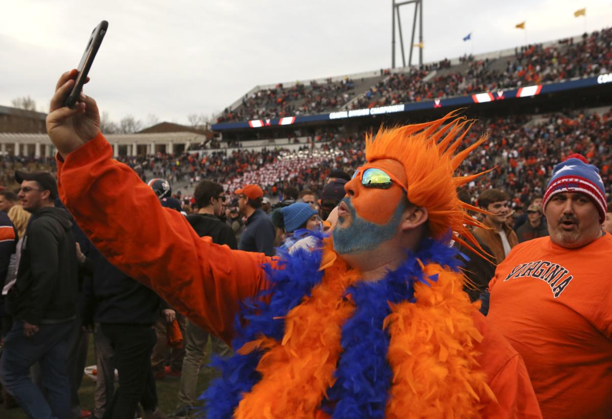 Virginia football players share postgame celebration with their fans Cavaliers