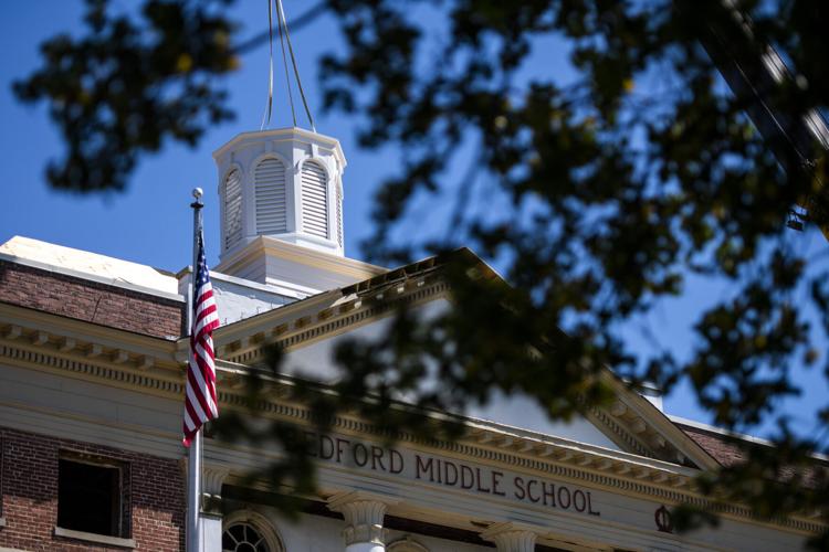Old Bedford Middle School crowned with cupola as redevelopment moves forward