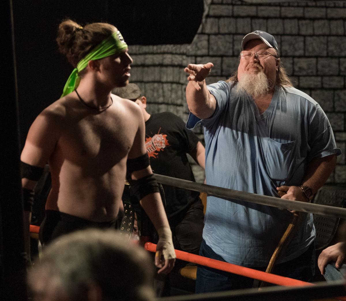 Pro wrestling fans soak in the ringside action in Amherst Sports