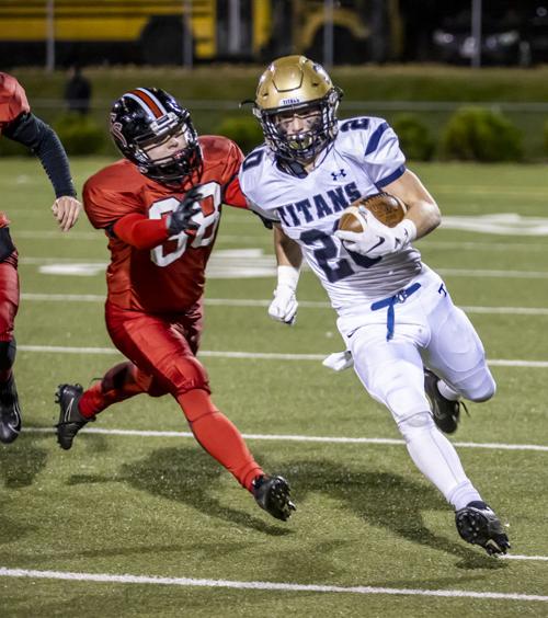 Hidden Valley's (20) Matt Strong turns the corner as Cave Spring's (88) Nathan Chapman tries to chases him down.