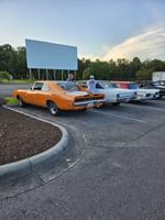 Classic cars join together for a drive-in movie at Planet Fun