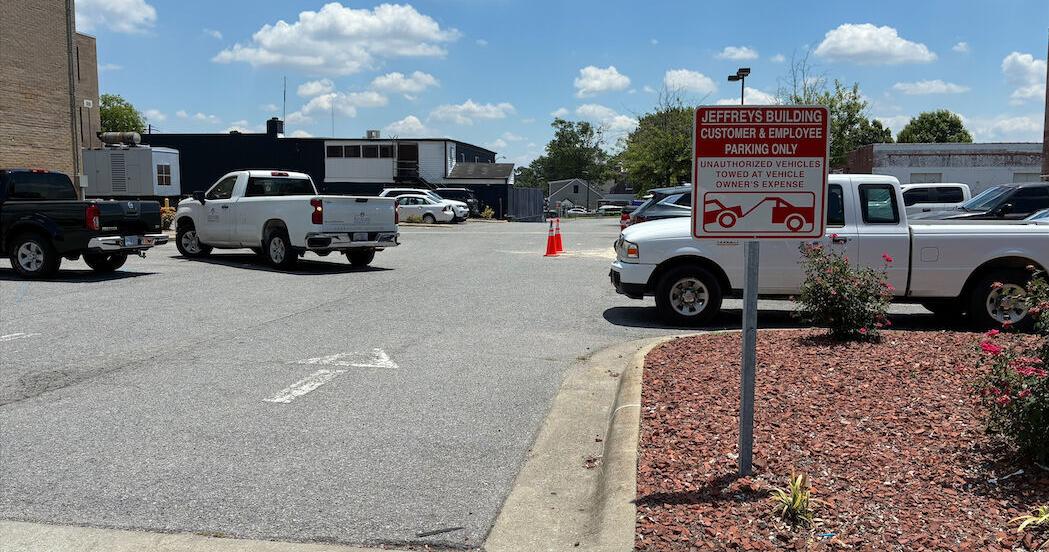 Parking lot fence near Torero's restaurant removed