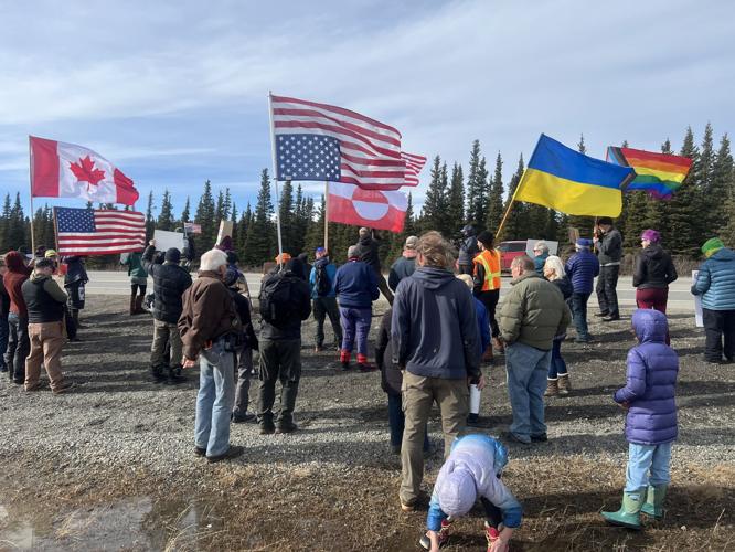 Colorful flags, penguins and protest signs fill Healy in 'Hands Off ...