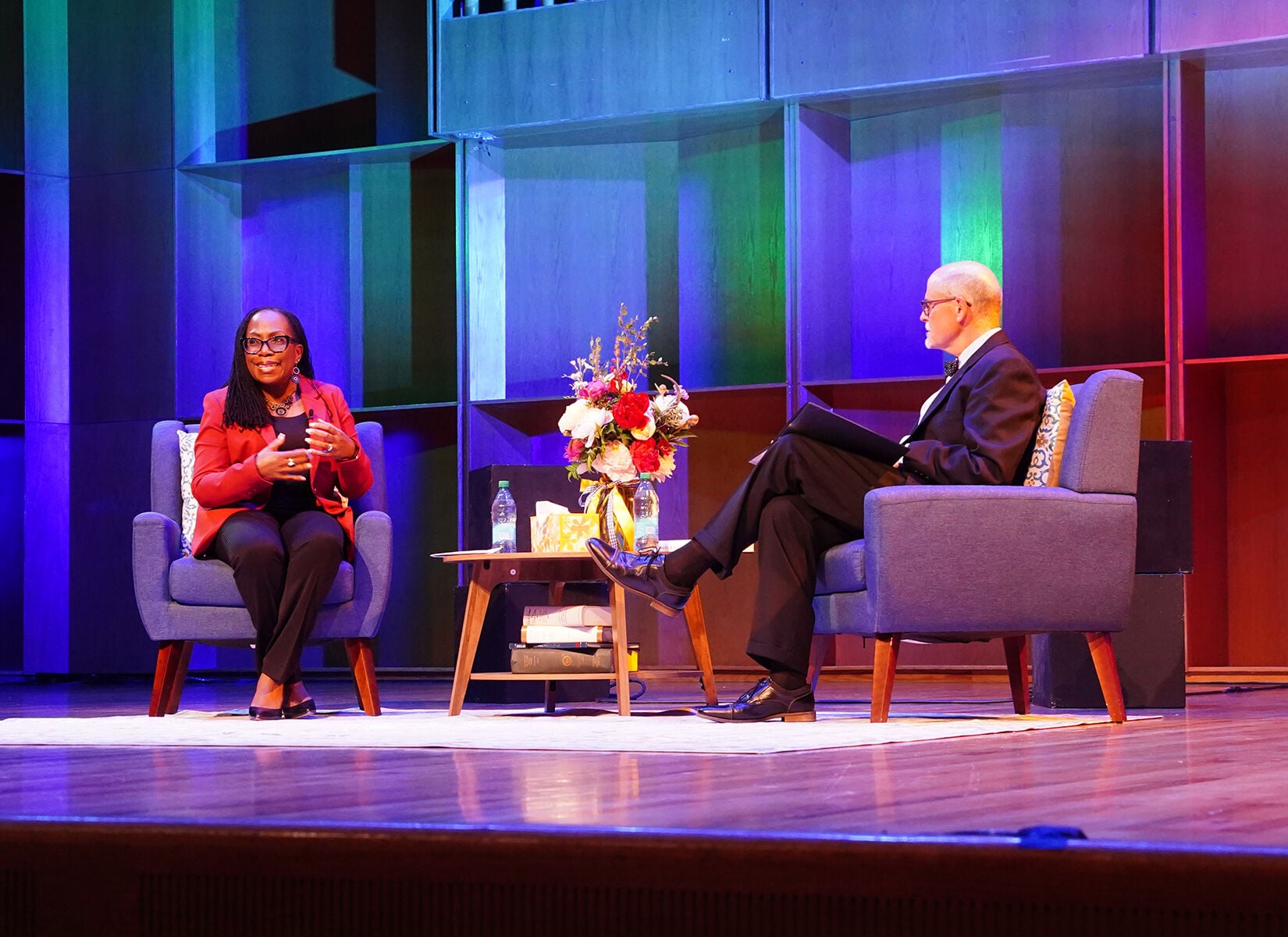 U.S. Supreme Court Justice Ketanji Brown Jackson and Robert Hanon sit on stage for a live interview