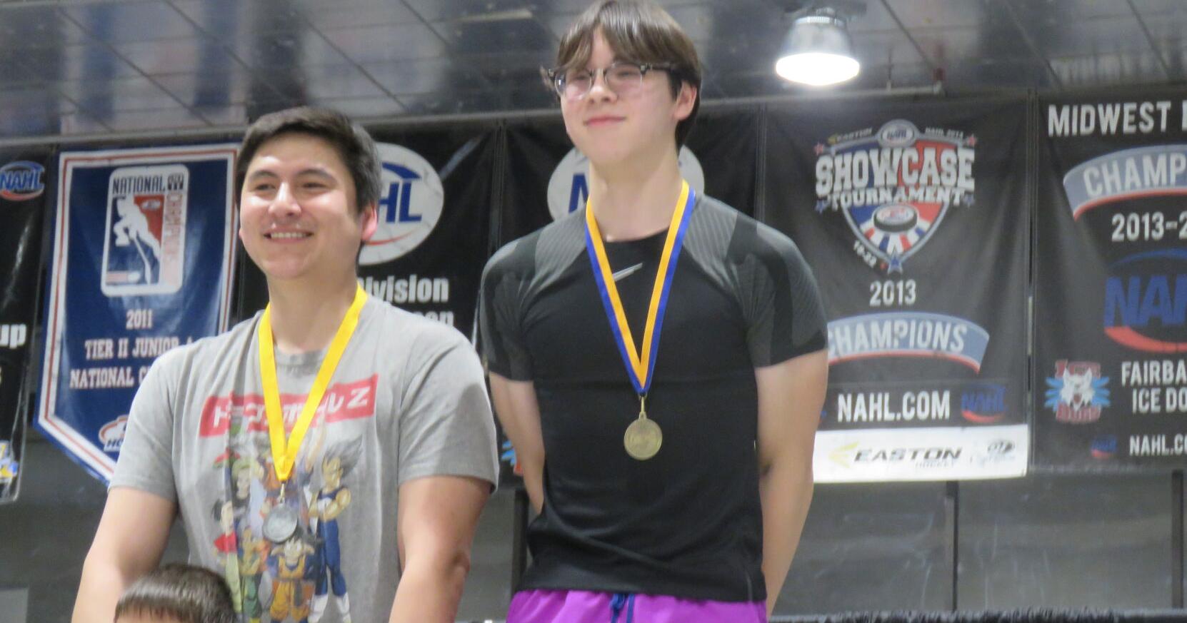 Peter Griggs receives his gold medal in the greased pole walk - Vimarsana News