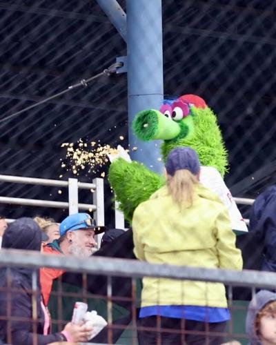 The Phillie Phantic has on his rain hat and jacket during the game