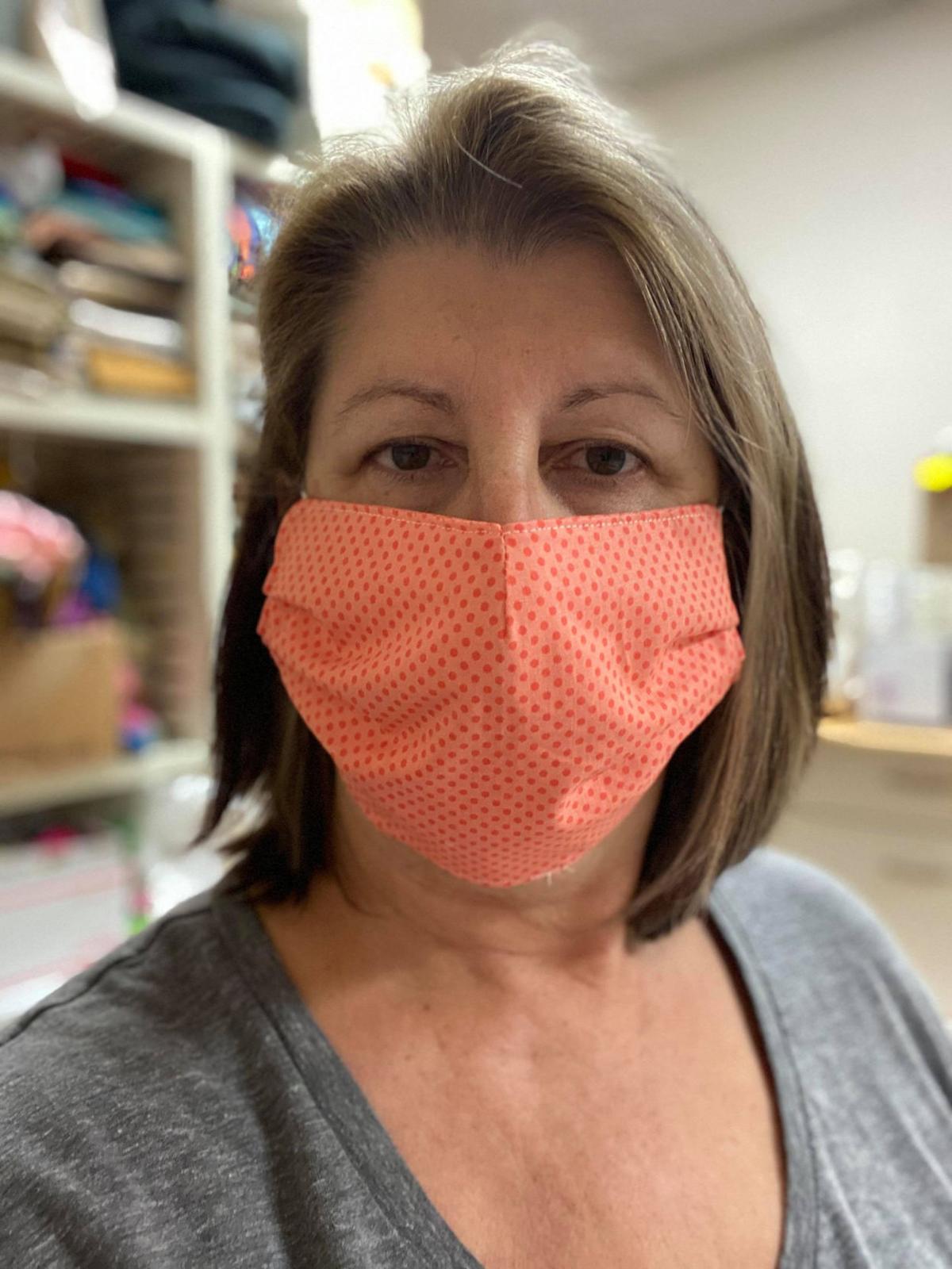 Volunteers sew face masks to limit COVID  19  Alerts 