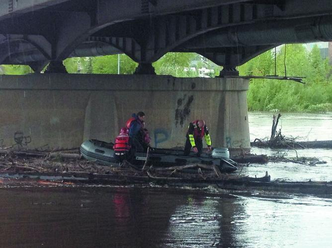 Two rescued when canoe gets stuck in Chena River flood debris | Local ...