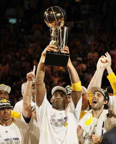 Kobe Bryant June 12, 2002 - Los Angeles Kobe Bryant holds the NBA  championship trophy in the