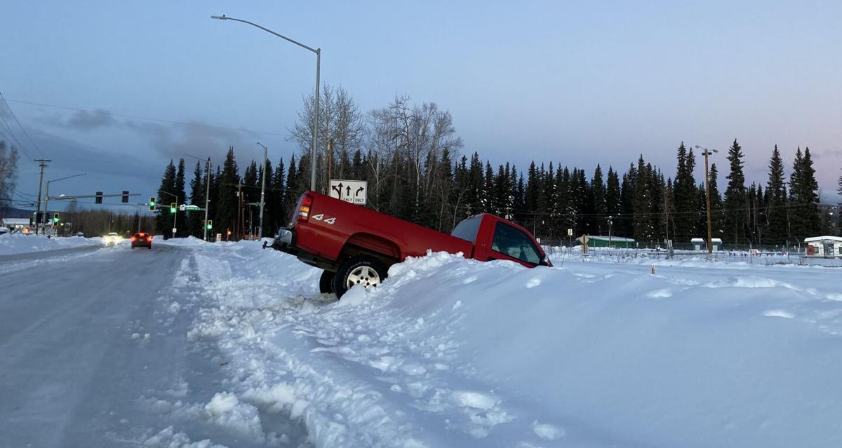 Truck nosedives into snow in Fairbanks