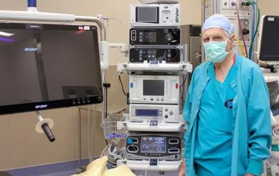 Dr. William Montano stands next to a Stryker 4D Laparoscope at Fairbanks Memorial Hospital