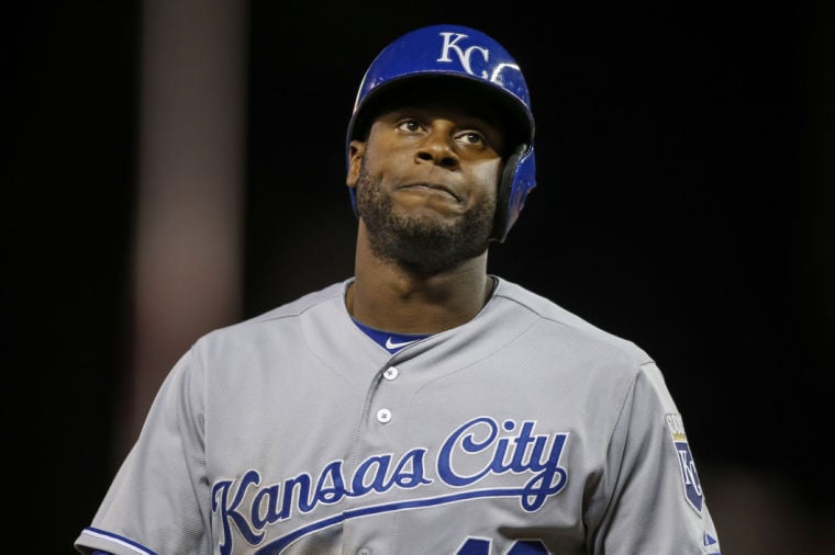 Former Kansas City Royals center fielder Lorenzo Cain reacts