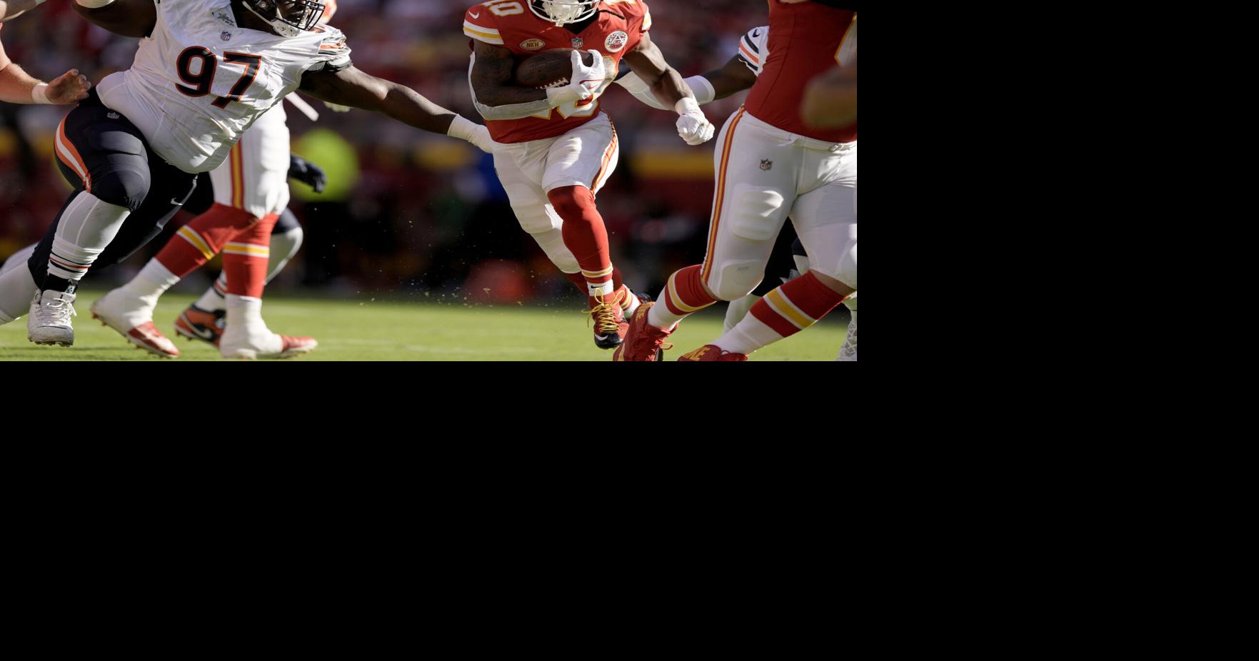 Kansas City Chiefs running back Isiah Pacheco (left) exchanges his