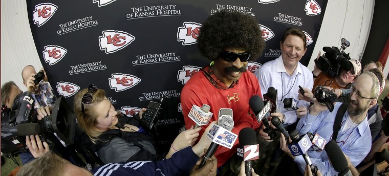 Deion Sanders, dressed as Leon Sandcastle talks to the media at the Kansas  City Chiefs training facility Thursday, March 28, 2013, in Kansas City, Mo.  Sanders, an NFL Network analyst and former