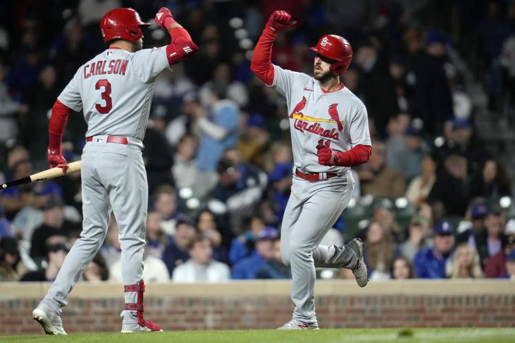 St. Louis Cardinals' Nolan Gorman, right, hits a home run during