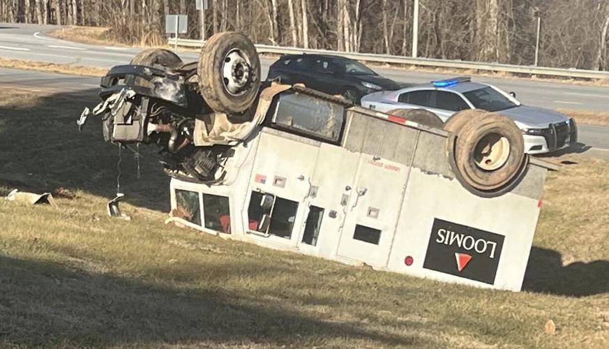 Armored truck crashes, flips on U.S. Highway 321