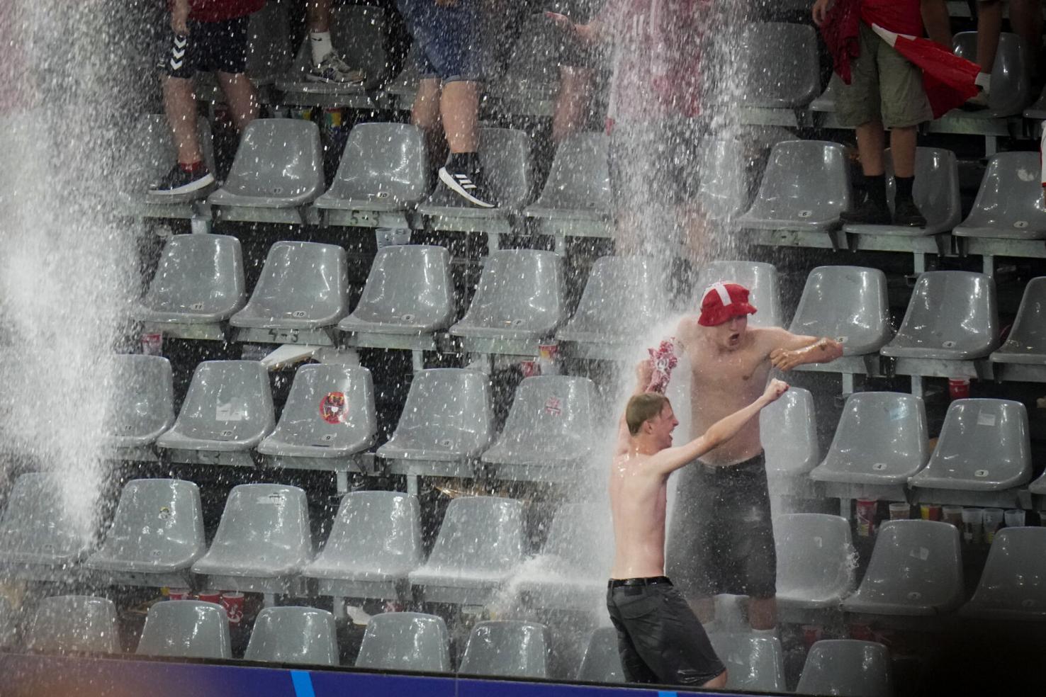 Sports Week in Pictures Soccer fans dance in the rain at Euro 2024