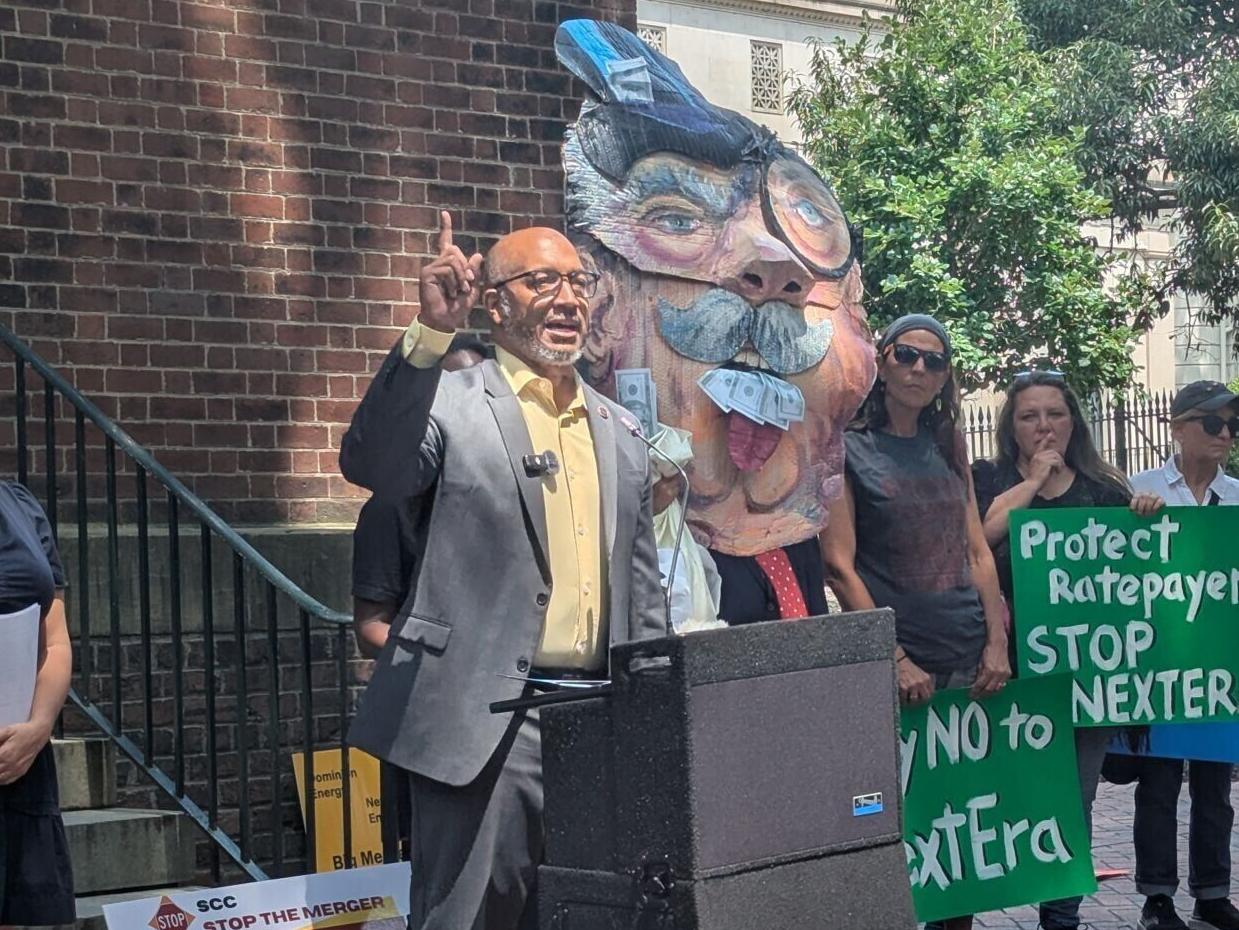 Virginia state Sen. Mike Jones, D-Richmond, speaks at a rally protesting the NextEra-Dominion Energy merger, Monday, July 20, 2026, on Capitol Square in Richmond.