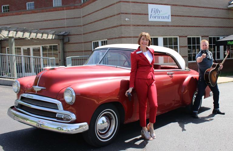 FiftyForward CEO Sallie Hussey and musician Gary Jenkins in front of 51 Chevy.jpg
