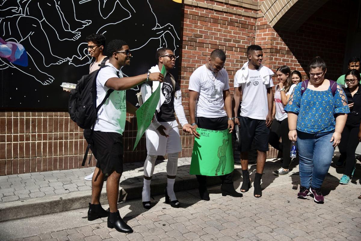 ‘A Mile In Her Shoes’: UCF organization hosts walk for domestic violence awareness month