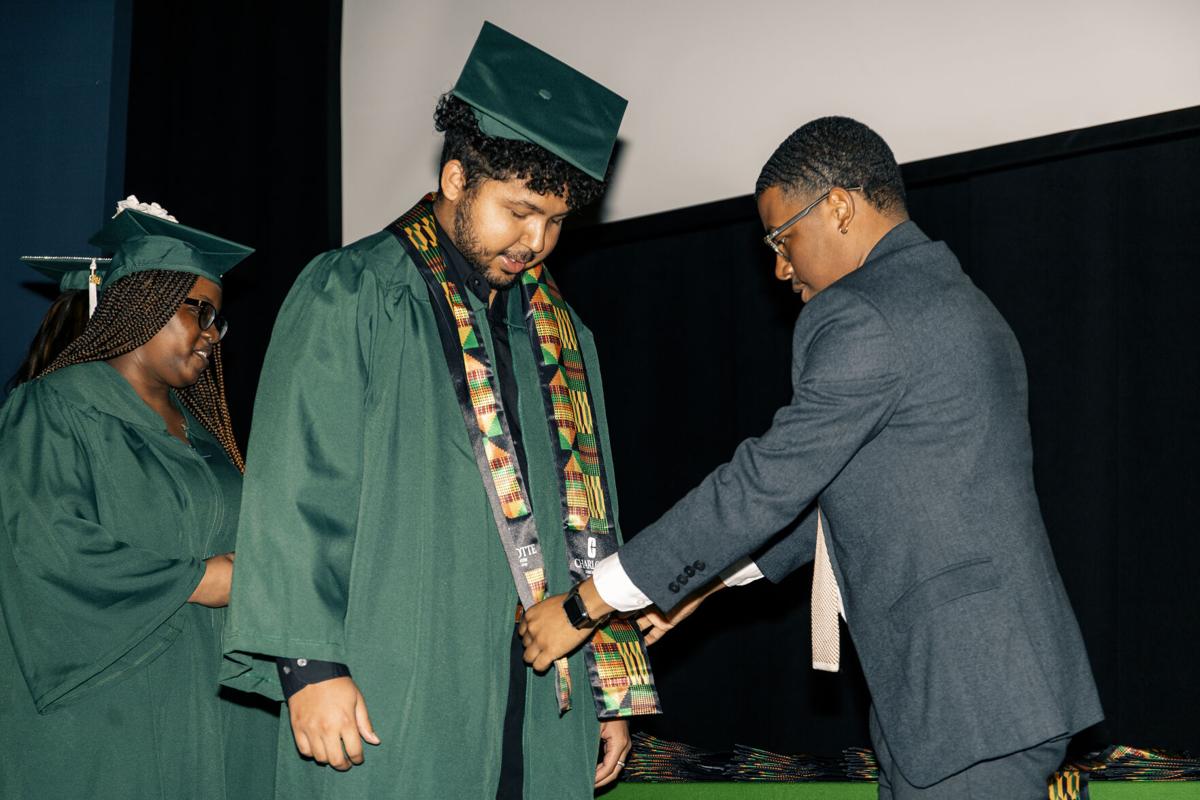 uncc graduation dress code UNC Charlotte celebrates Black graduates with Donning of the Kente ceremony uncc masters graduation