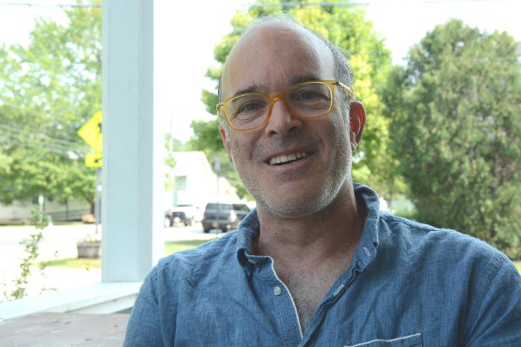 Aaron Woolf is busy with local economic development, but has wistful ...